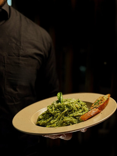 Pesto pasta plating — restaurant menu photography
